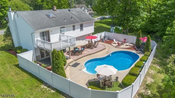 swimming pool view with a seating space