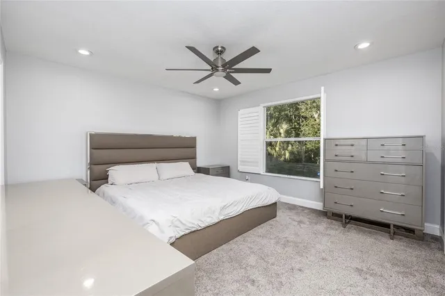 a bedroom with a bed and a dresser