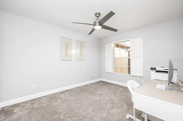 a view of livingroom and a window