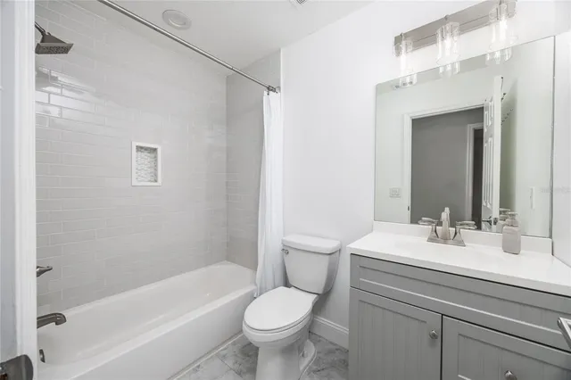 a bathroom with a sink toilet and bathtub