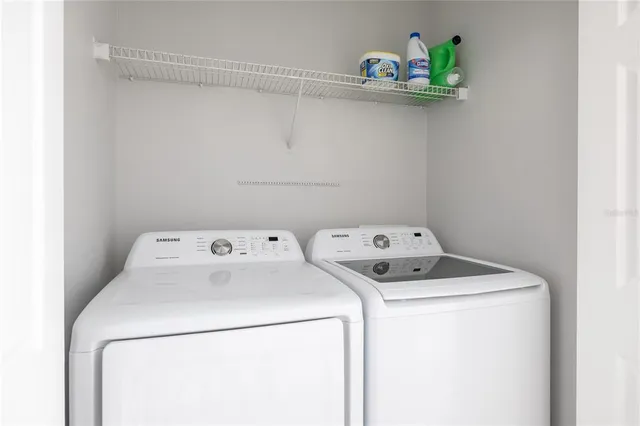 a utility room with dryer and washer