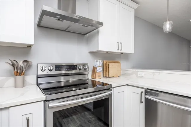a kitchen with a stove and a microwave