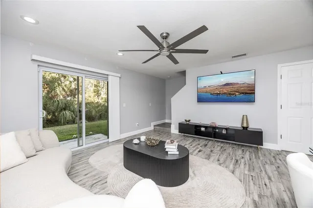 a living room with furniture and a large window