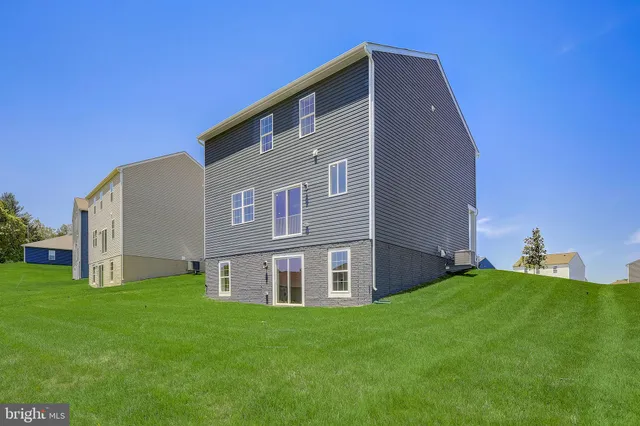 a house view with a big yard