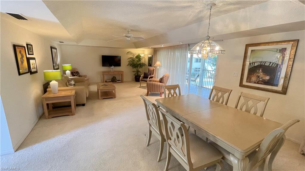 801 Teryl Road, Unit 4 Naples, FL 34112 - Photo 12 of 19 Dining space with light carpet, ceiling fan, and spot lighting