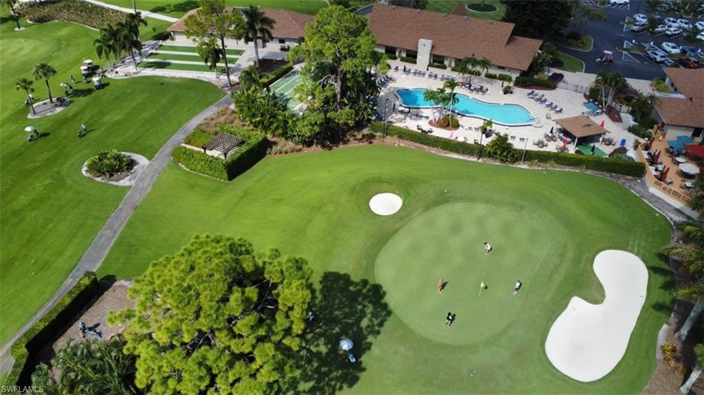 801 Teryl Road, Unit 4 Naples, FL 34112 - Photo 16 of 19 Aerial view of main pool, clubhouse, bocce courts, shuffleboard, admin building, 19th hole restaurant and 9th green of the Palmetto golf course.