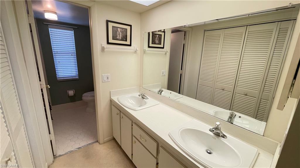 801 Teryl Road, Unit 4 Naples, FL 34112 - Photo 8 of 19 Full bath with a closet and double vanity