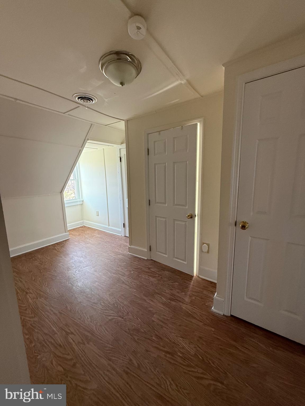 9253 Dahlgren Road King George, VA 22485 - Photo 13 of 23 an empty room with wooden floor and windows