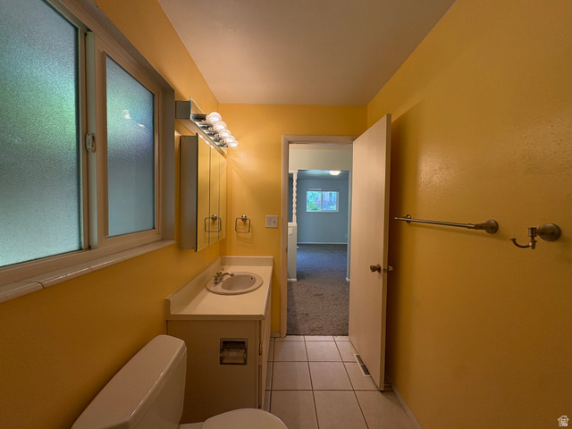 595 Meadowlark Road Orem, UT 84097 - Photo 29 of 87 Bathroom with a single vanity, integrated sink, and white countertop