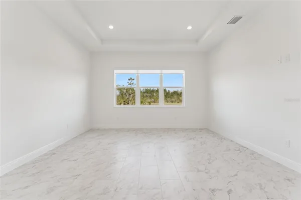 a bathroom with a bathtub sink and mirror