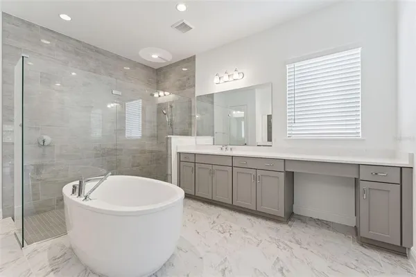 a bathroom with a bathtub and a toilet