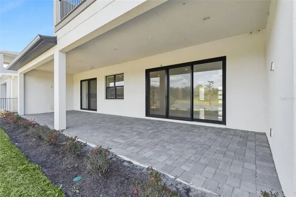 a front view of a house with a yard table and chairs