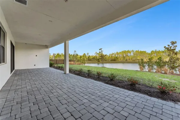 a aerial view of a house with swimming pool and a yard