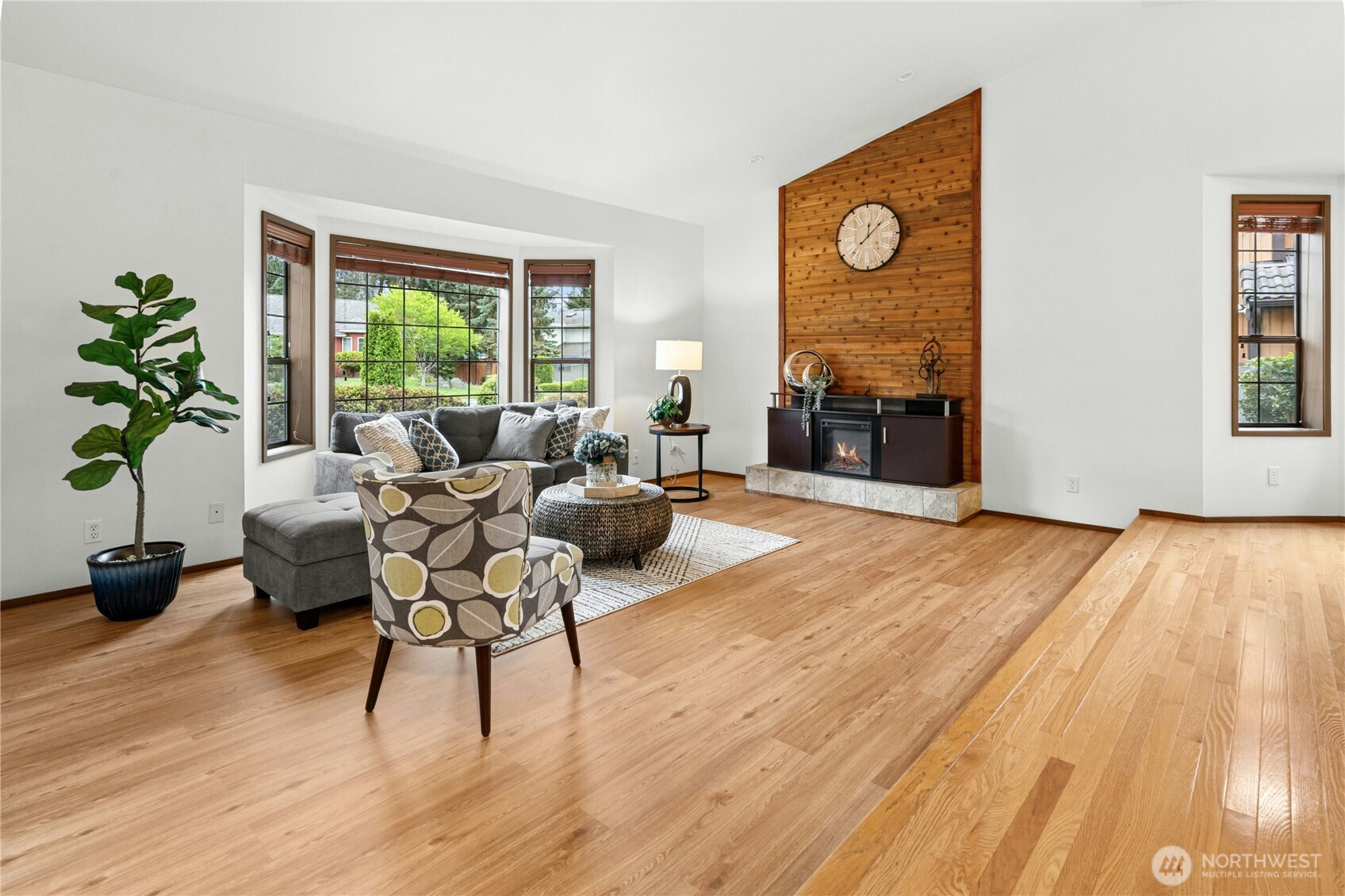 5211 103rd Street Southwest, Unit SW Mukilteo, WA 98275 - Photo 6 of 40 a living room with furniture and a fireplace