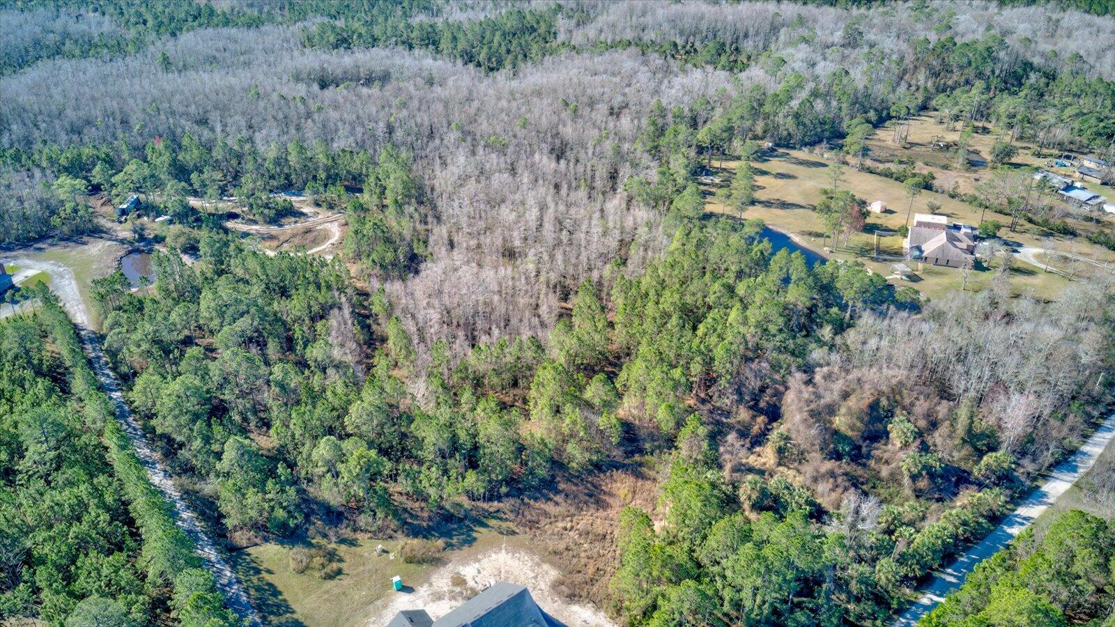 0 Rodeo Acres Drive Ormond Beach, FL 32174 - Photo 12 of 20 an aerial view of residential house with outdoor space and trees all around