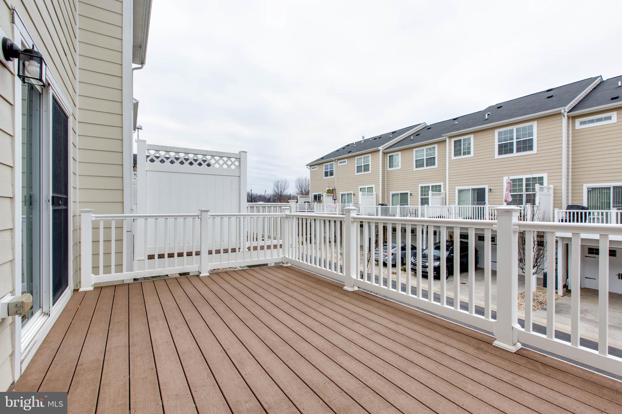 7926 Silver Oak Road Hanover, MD 21076 - Photo 22 of 44 a view of a balcony with wooden floor
