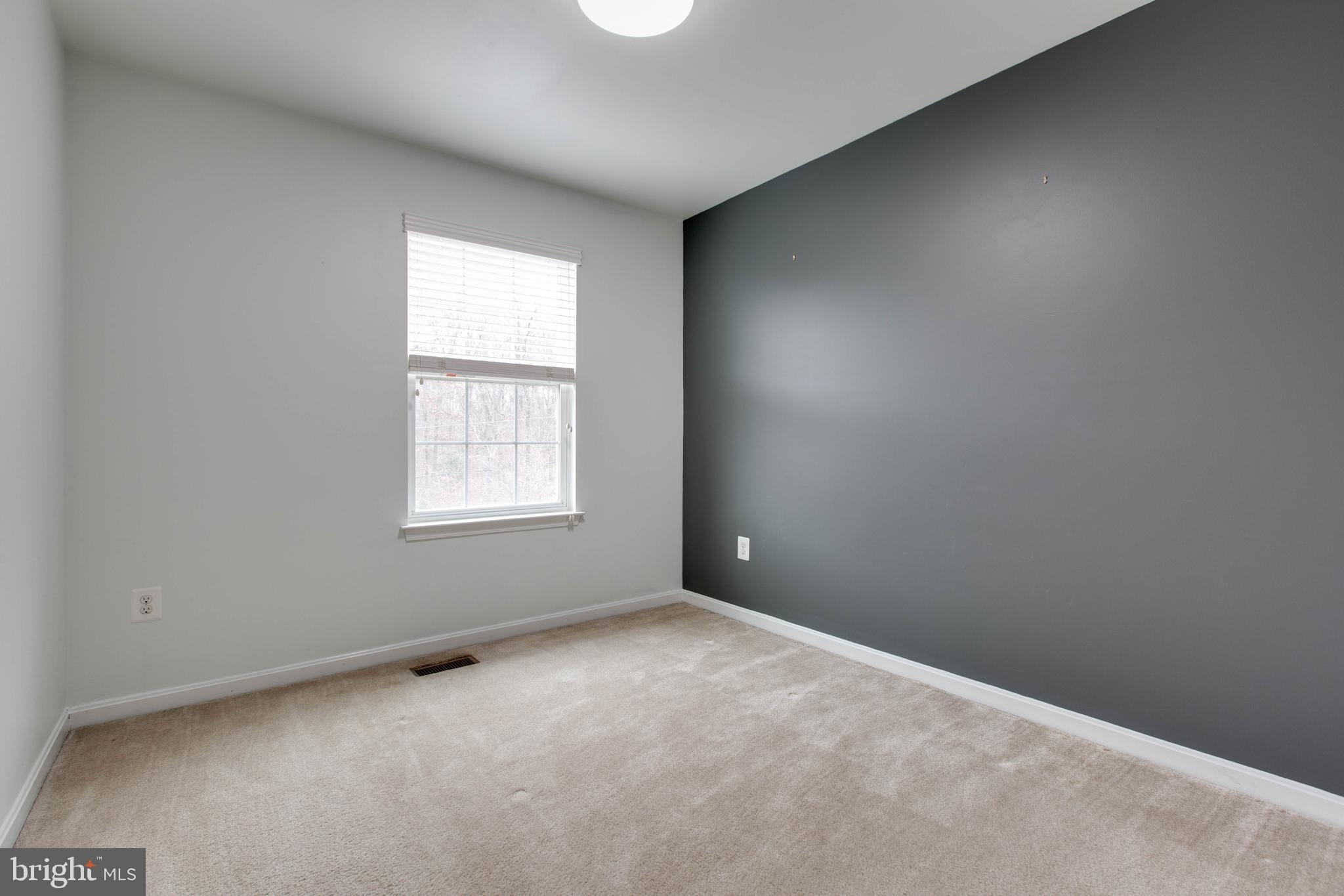 7926 Silver Oak Road Hanover, MD 21076 - Photo 30 of 44 an empty room with windows