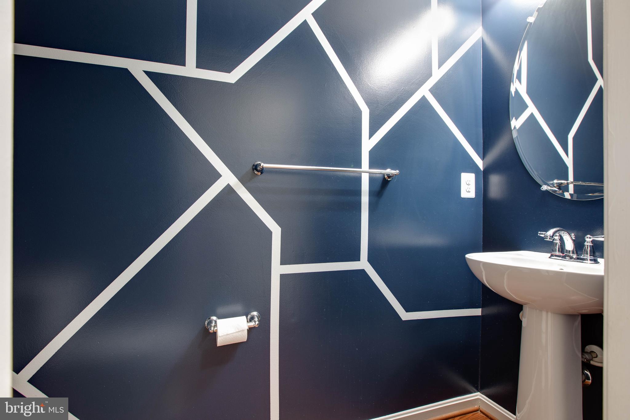 7926 Silver Oak Road Hanover, MD 21076 - Photo 41 of 44 a bathroom with a sink mirror and toilet