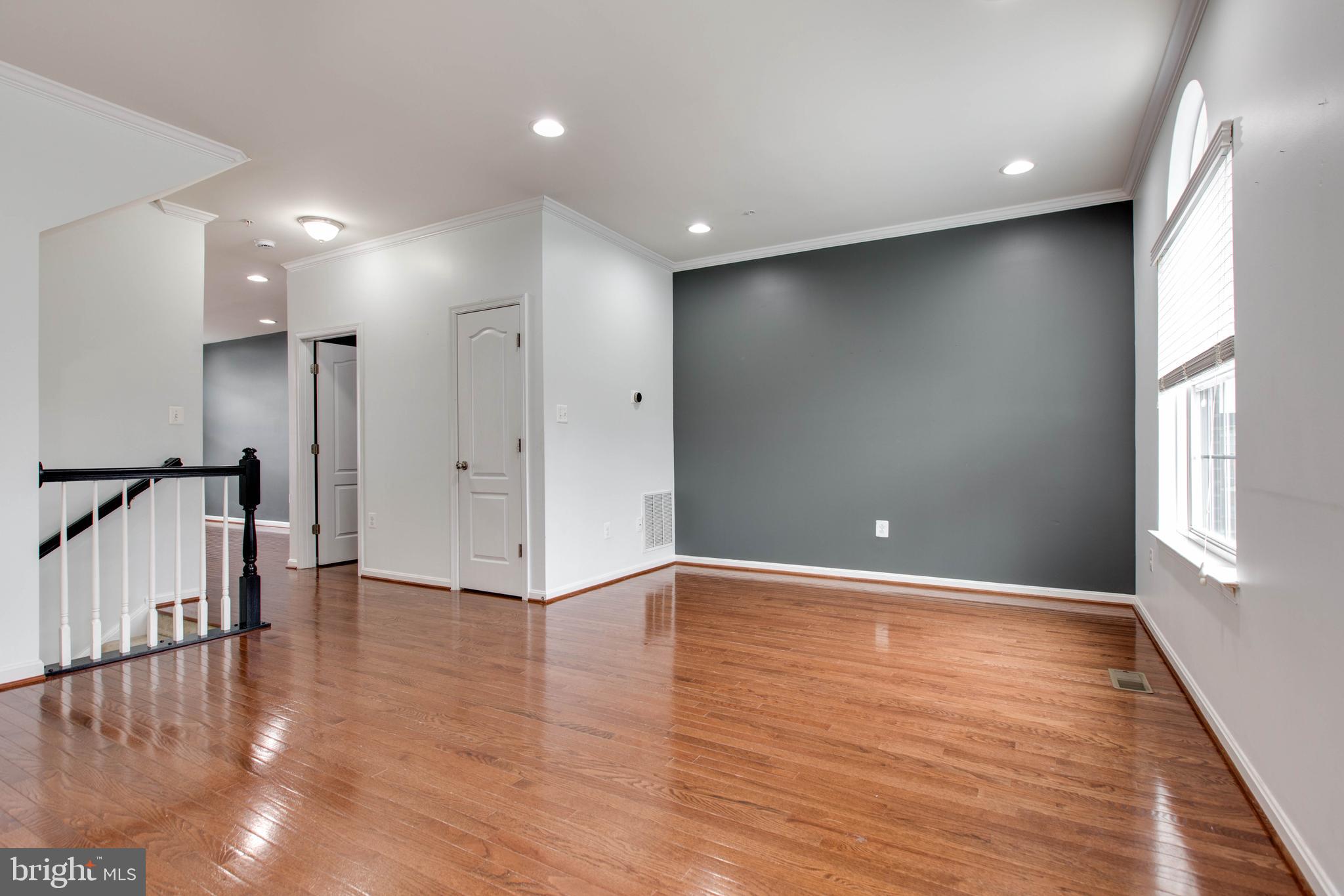 7926 Silver Oak Road Hanover, MD 21076 - Photo 6 of 44 a view of an empty room with wooden floor