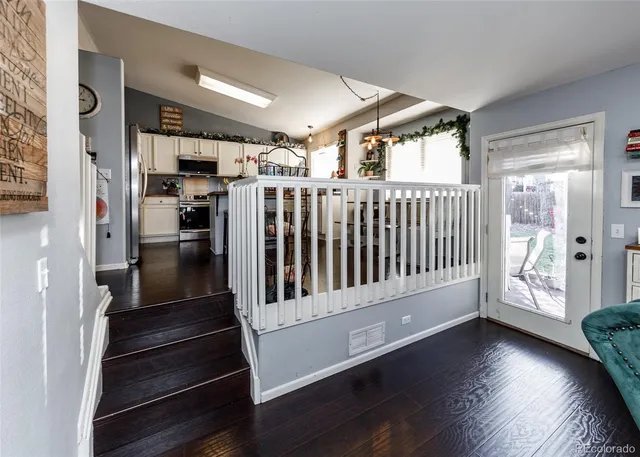 a view of entryway with stairs and wooden floor