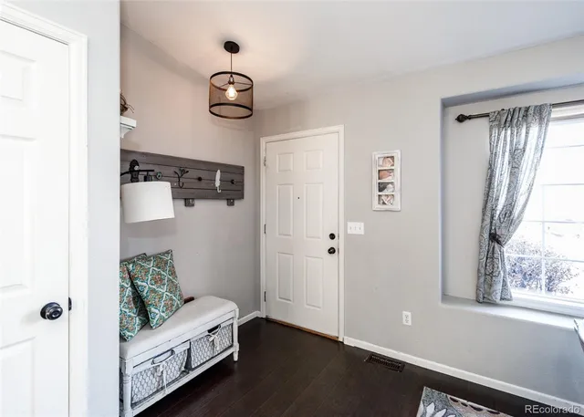 a view of room with window and wooden floor