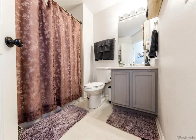 a living room with a couch and a flat screen tv