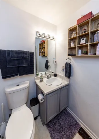 a bathroom with a toilet sink and shower