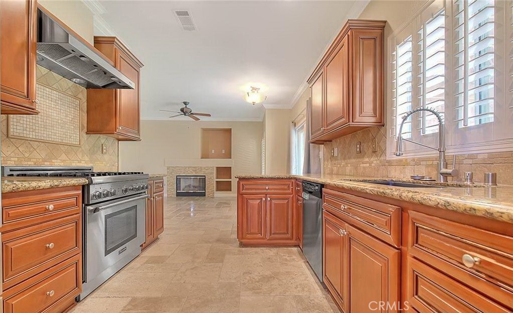 16410 Argent Road Chino Hills, CA 91709 - Photo 20 of 31 a kitchen with stainless steel appliances granite countertop a stove a sink and a refrigerator