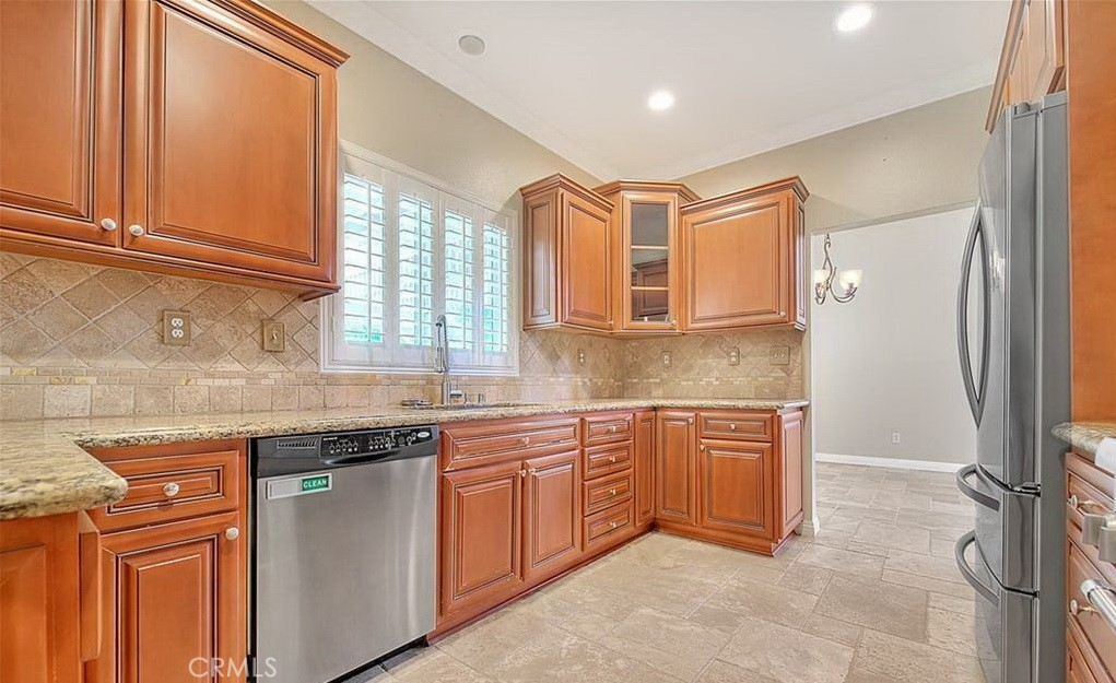 16410 Argent Road Chino Hills, CA 91709 - Photo 22 of 31 a kitchen with stainless steel appliances granite countertop a sink and a refrigerator