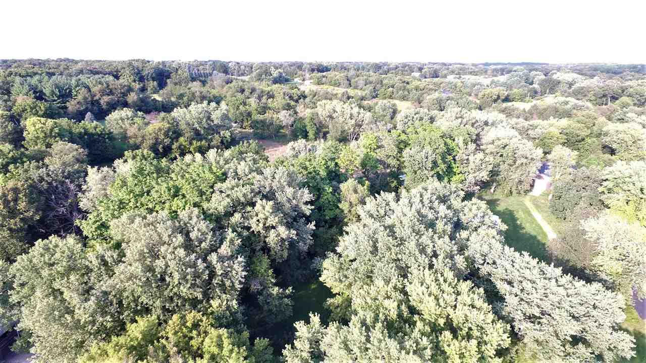8502 Burr Oak Road Roscoe, IL 61073 - Photo 2 of 14 an aerial view of residential houses with outdoor space and trees