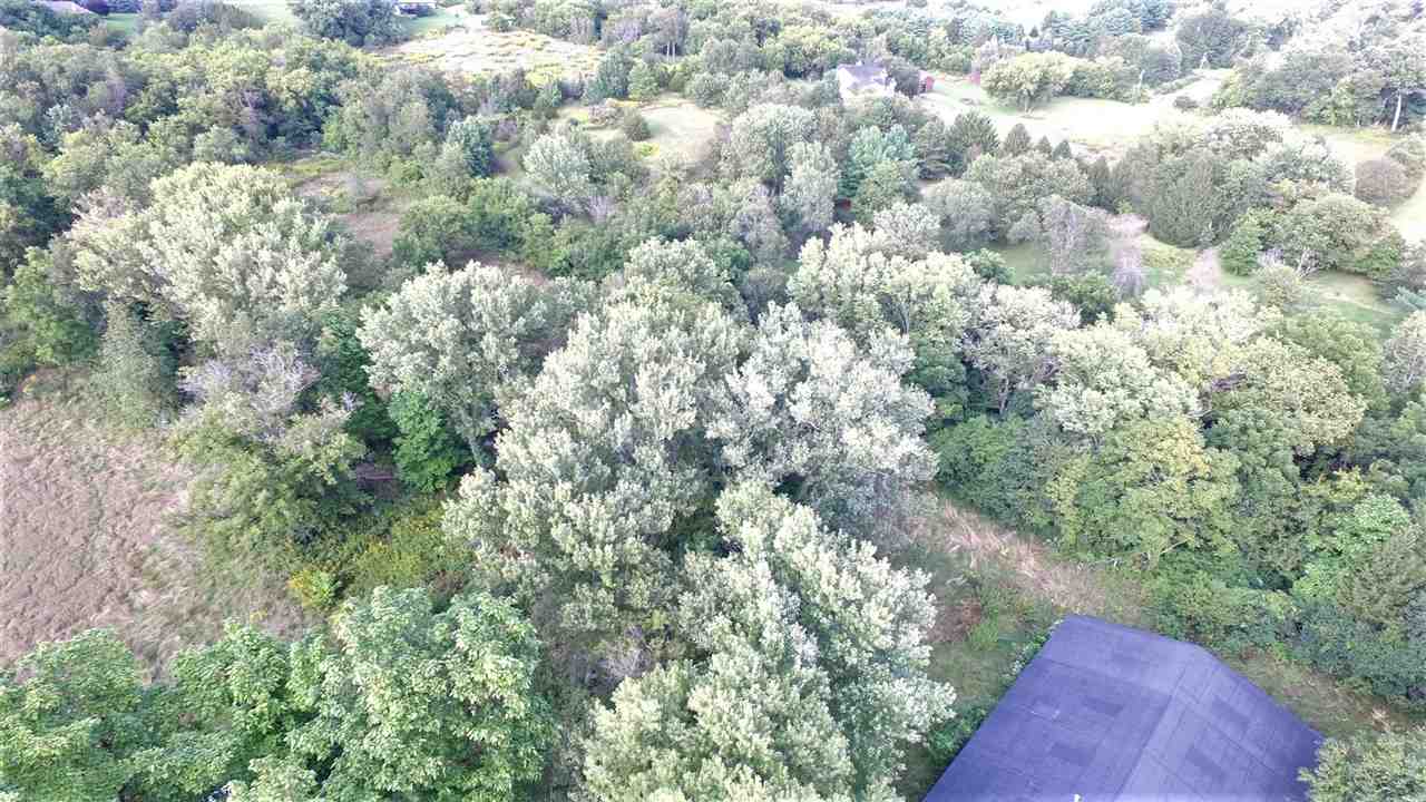 8502 Burr Oak Road Roscoe, IL 61073 - Photo 3 of 14 a view of a yard and trees