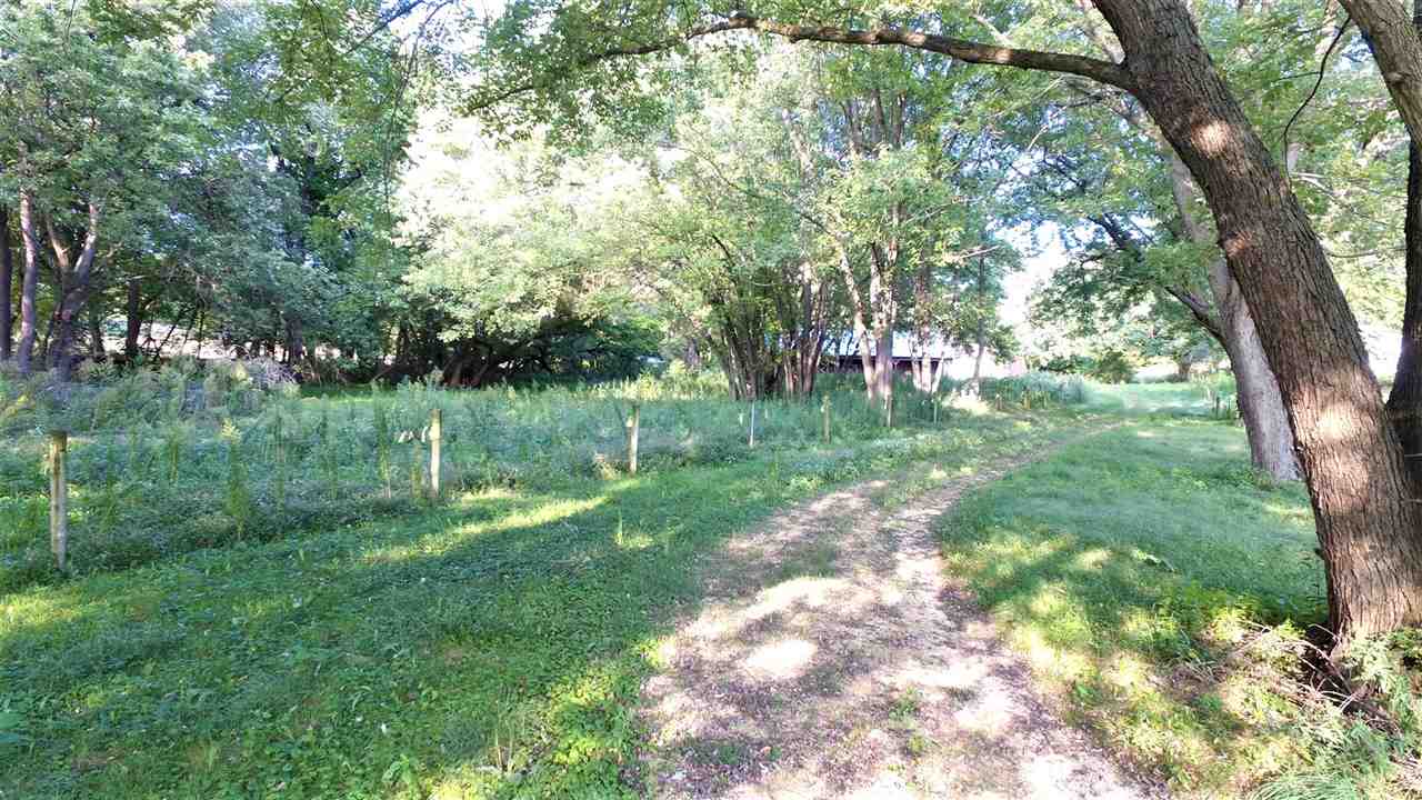 8502 Burr Oak Road Roscoe, IL 61073 - Photo 5 of 14 a view of a park with large trees