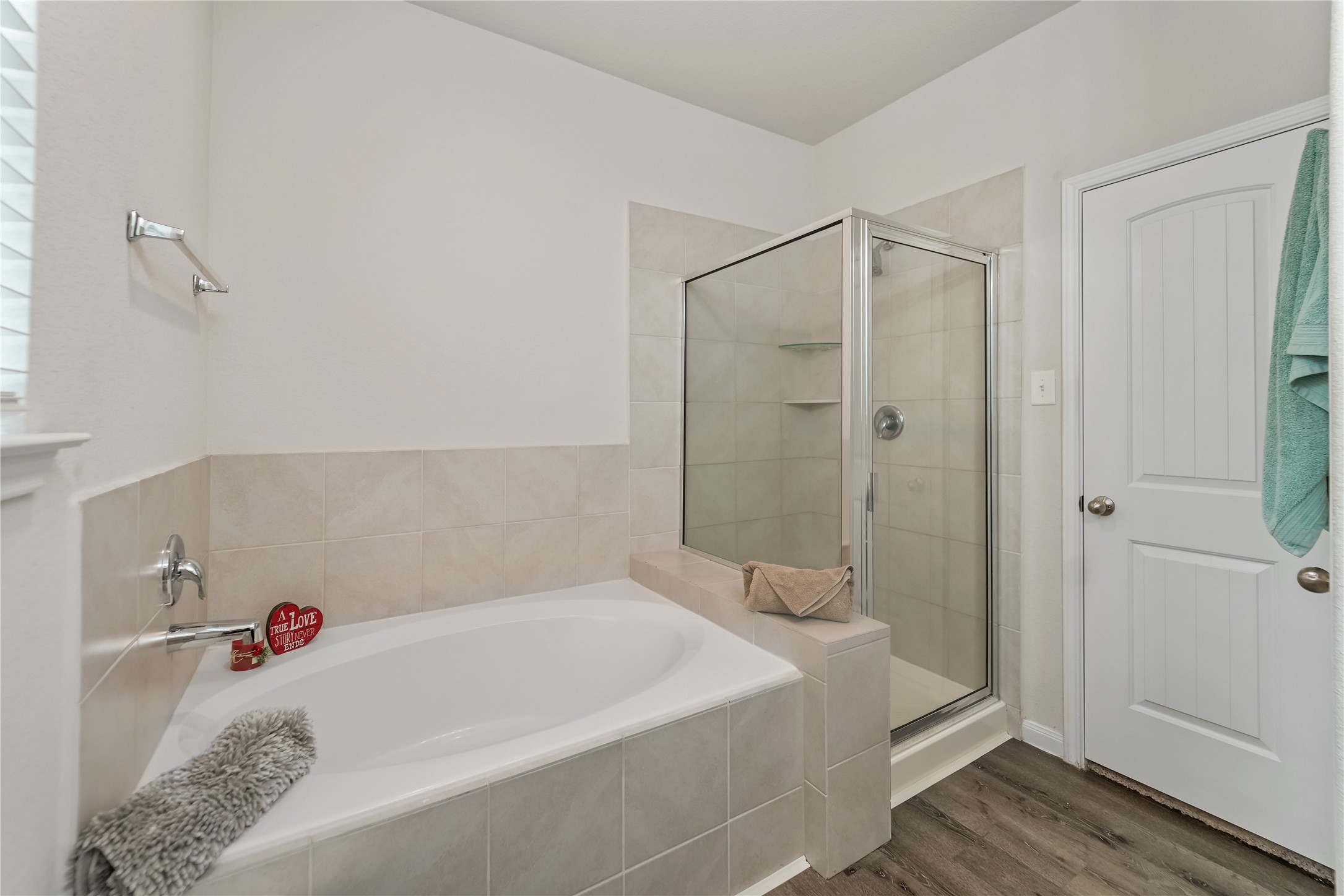 23659 Goodfellow Drive Spring, TX 77373 - Photo 12 of 25 a bathroom with a bathtub and a shower