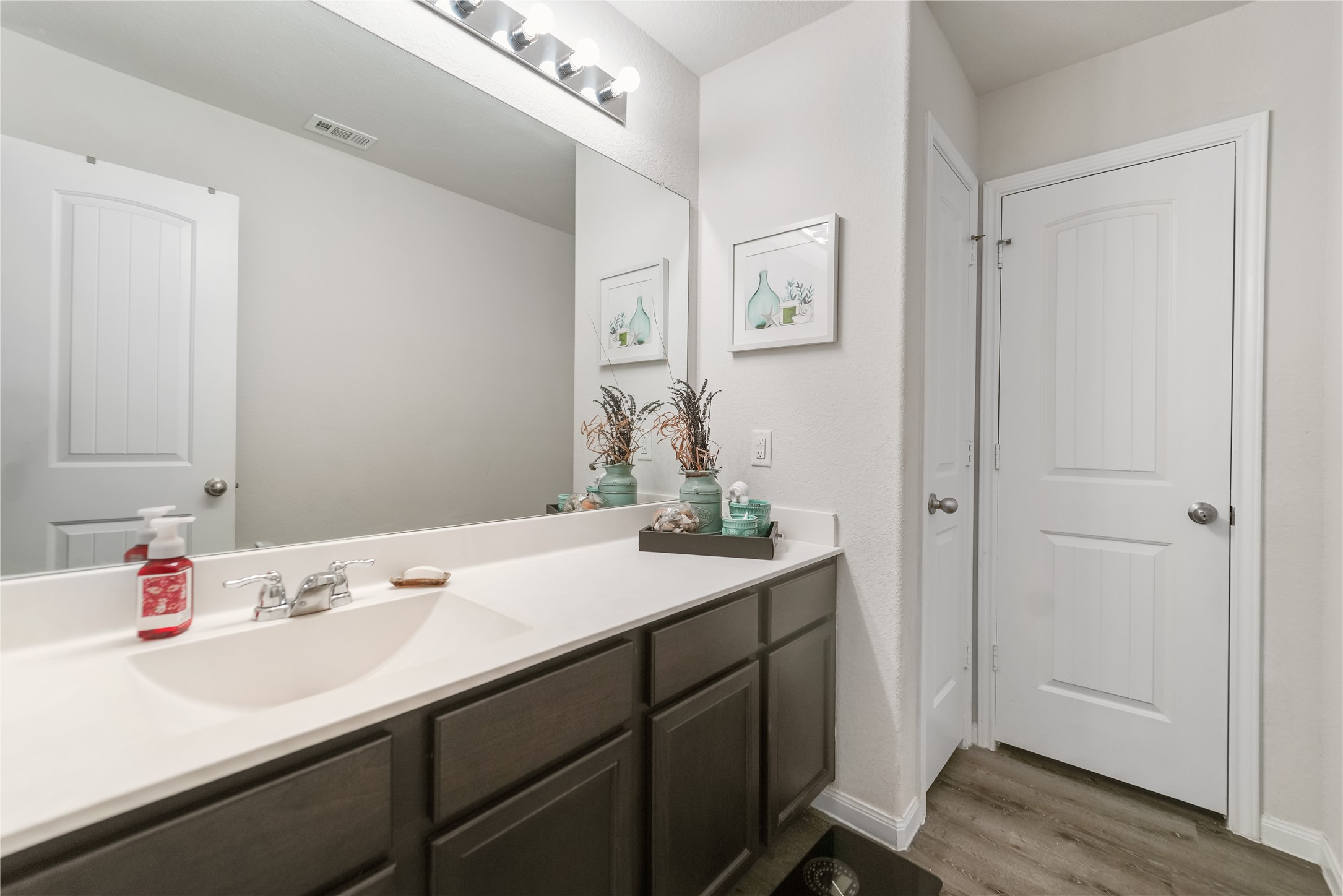 23659 Goodfellow Drive Spring, TX 77373 - Photo 20 of 25 a bathroom with a sink and a mirror