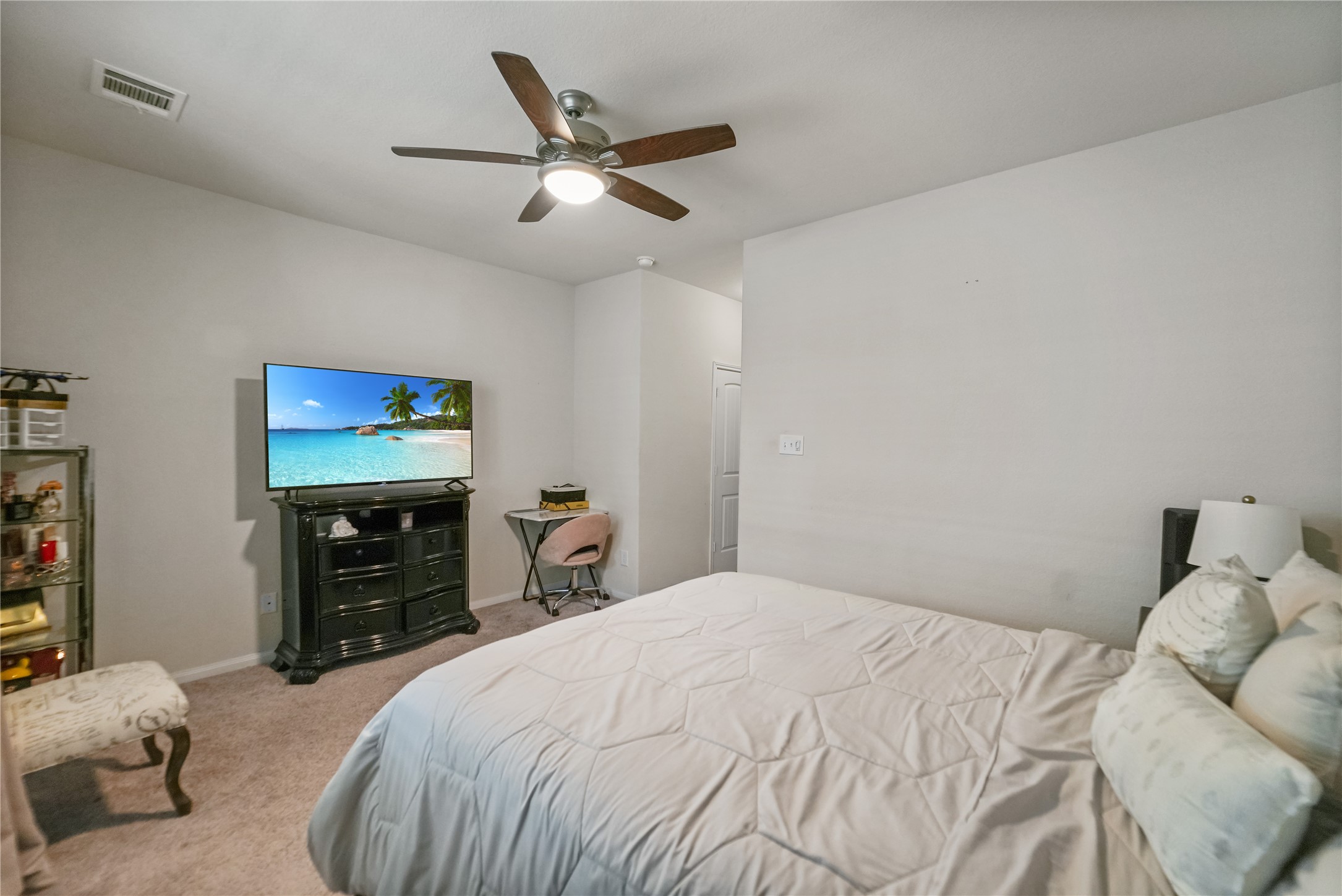 23659 Goodfellow Drive Spring, TX 77373 - Photo 21 of 25 a bedroom with a bed and a flat screen tv