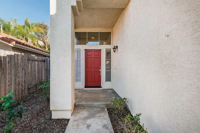 a view of a pathway of a house with backyard