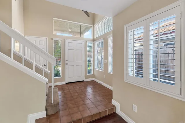 a view of an entryway with wooden floor and windows