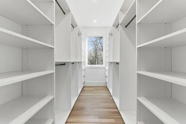 a view of a hallway with white walls