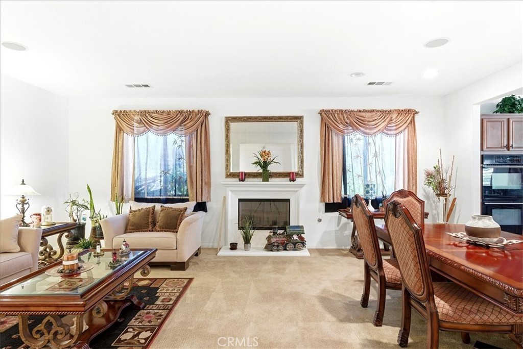 17715 Timberview Drive Riverside, CA 92504 - Photo 16 of 46 a living room with furniture fireplace and a large window