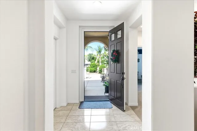 a bedroom with a bed and a lamp with window