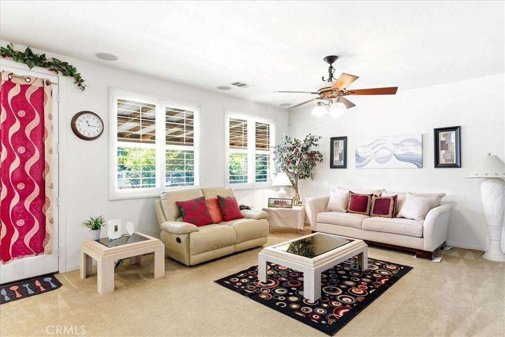 17715 Timberview Drive Riverside, CA 92504 - Photo 4 of 46 a living room with furniture a rug and a large window