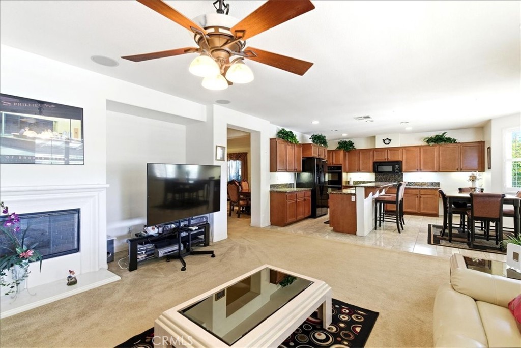 17715 Timberview Drive Riverside, CA 92504 - Photo 7 of 46 a living room with lots of furniture and kitchen view