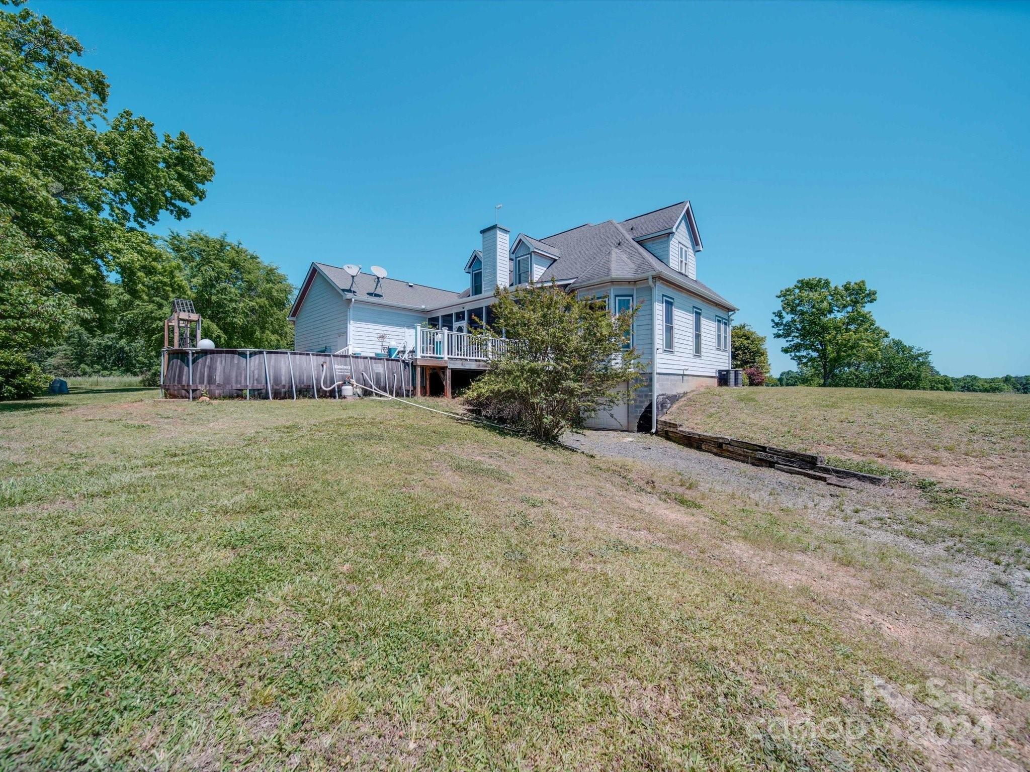 1818 Snyders Store Road Wingate, NC 28174 - Photo 46 of 47 a view of a house with a yard and potted plants