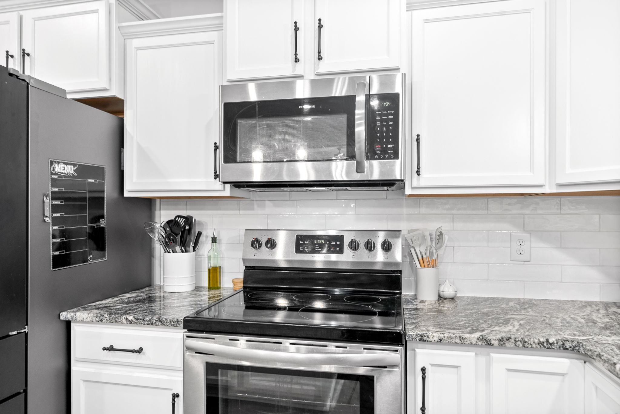 206 Clark Road Clarksville, TN 37042 - Photo 13 of 37 a stove top oven sitting inside of a kitchen