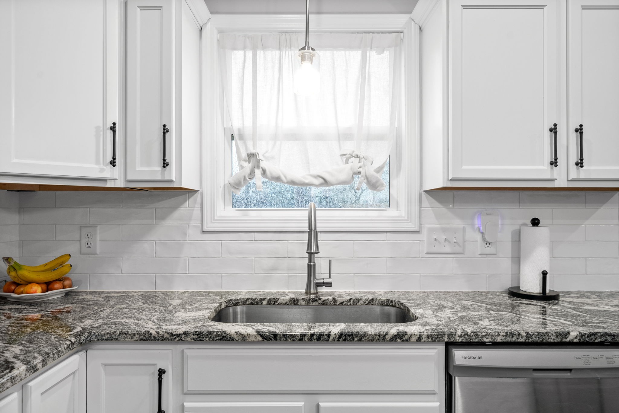 206 Clark Road Clarksville, TN 37042 - Photo 14 of 37 a kitchen with granite countertop white cabinets and a window