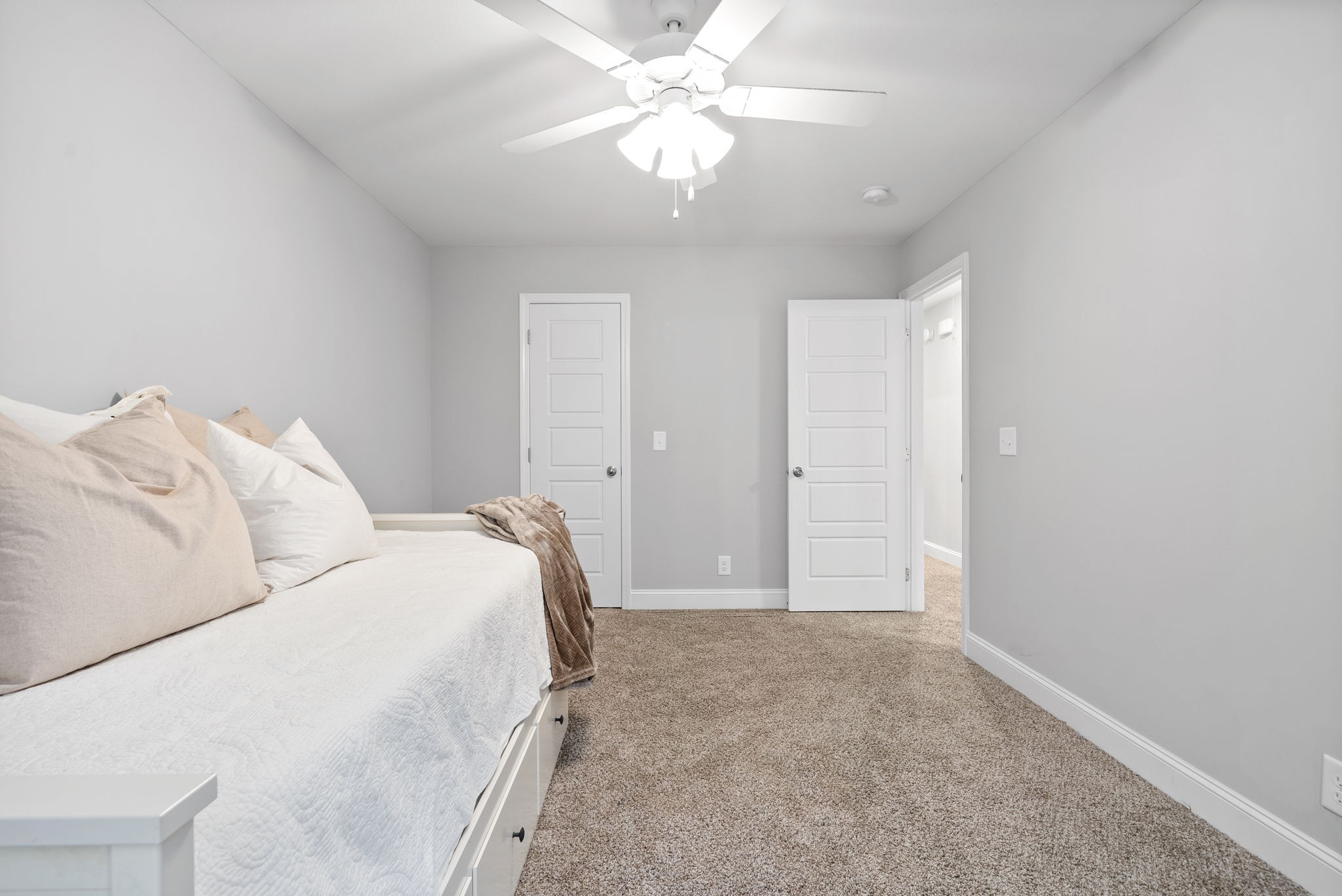 206 Clark Road Clarksville, TN 37042 - Photo 28 of 37 a spacious bedroom with a bed and a chandelier fan