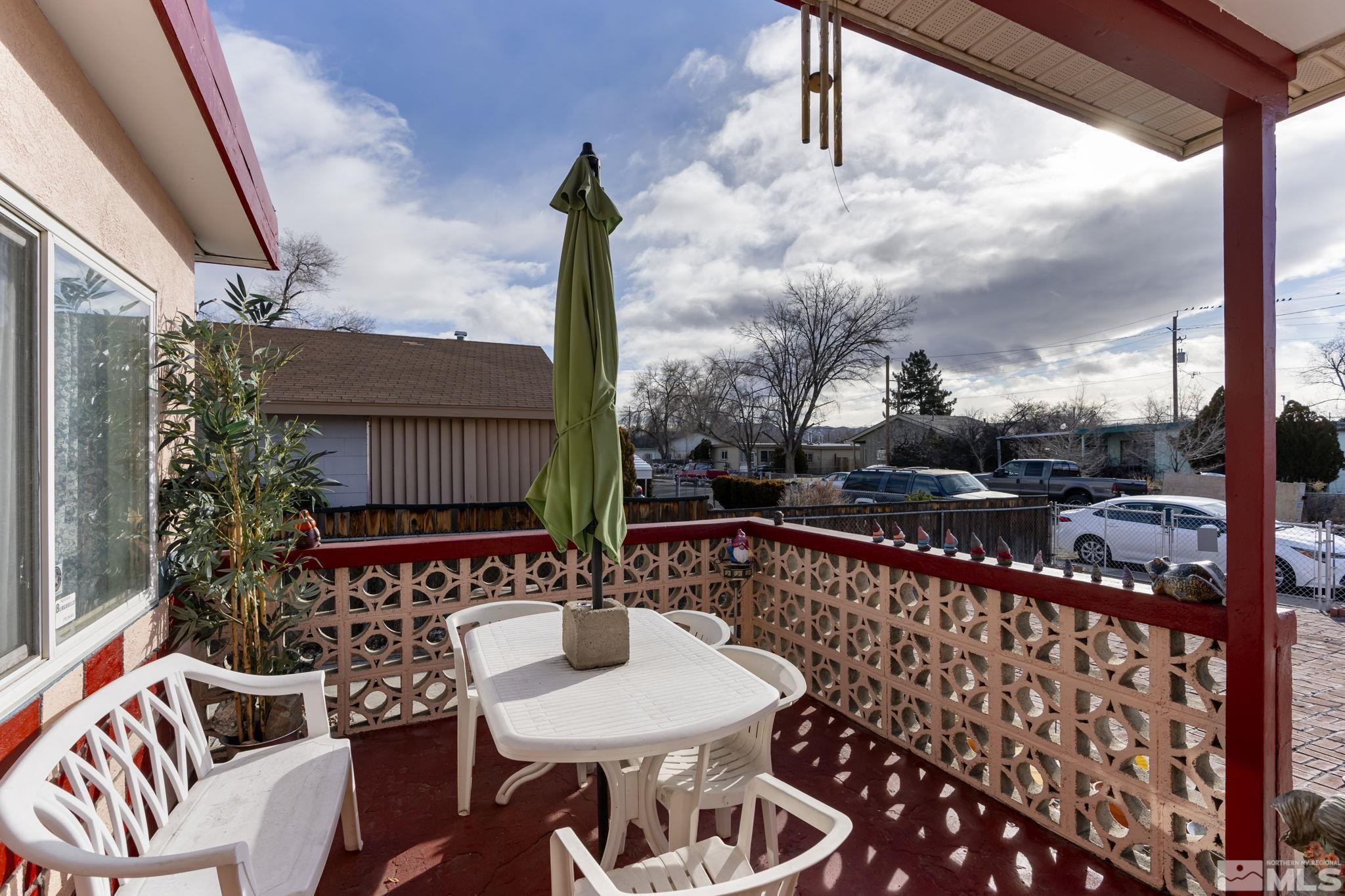 1885 Castle Way Reno, NV 89512 - Photo 17 of 18 a view of a balcony with table and chairs
