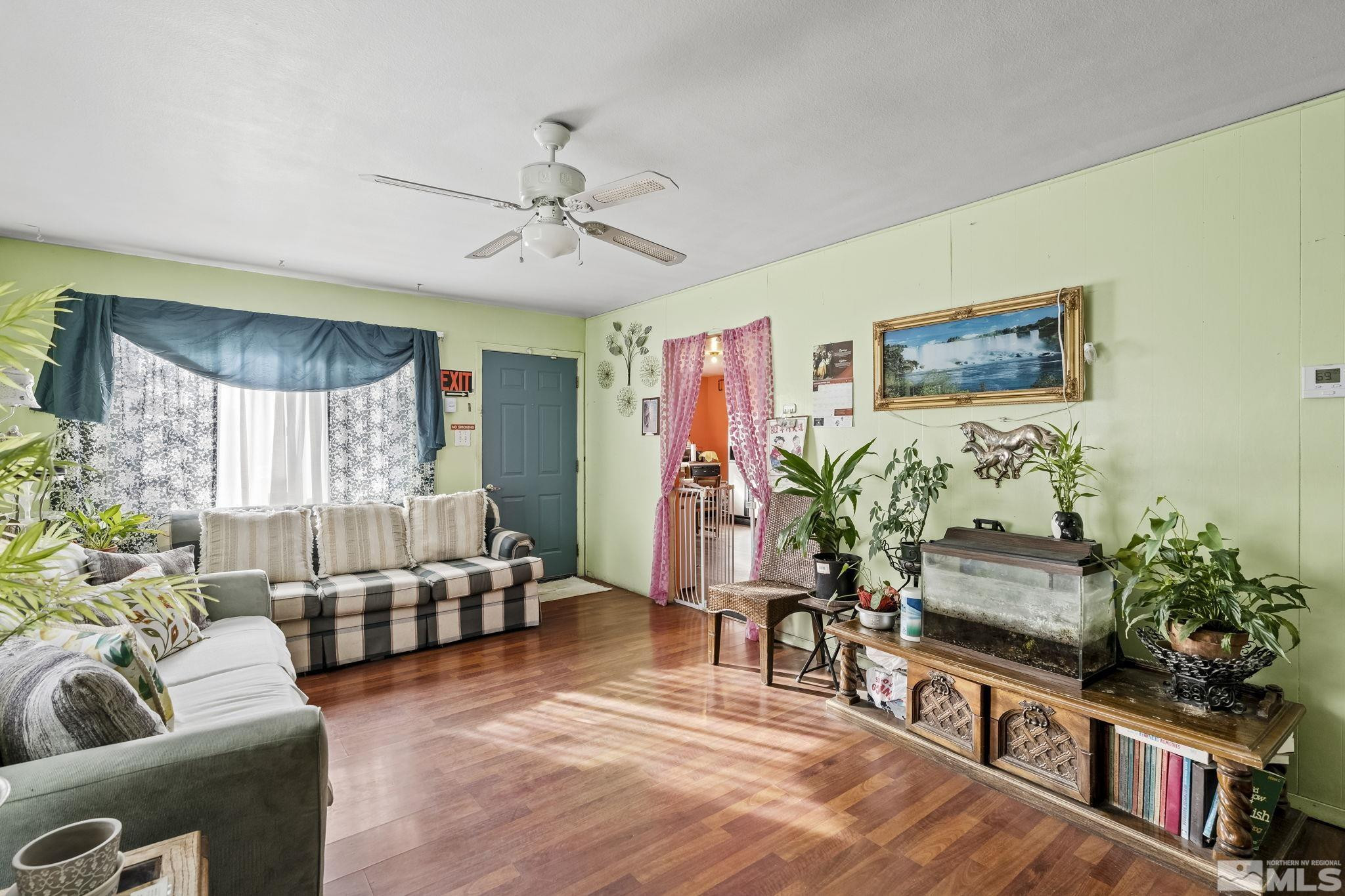 1885 Castle Way Reno, NV 89512 - Photo 2 of 18 a living room with furniture and a flat screen tv