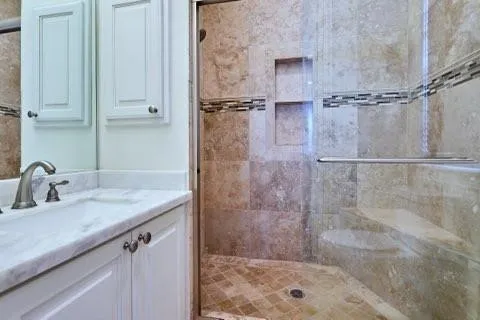 a bathroom with a shower and a sink
