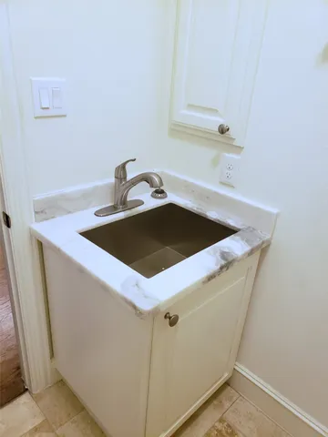 a view of an house with backyard space and windows